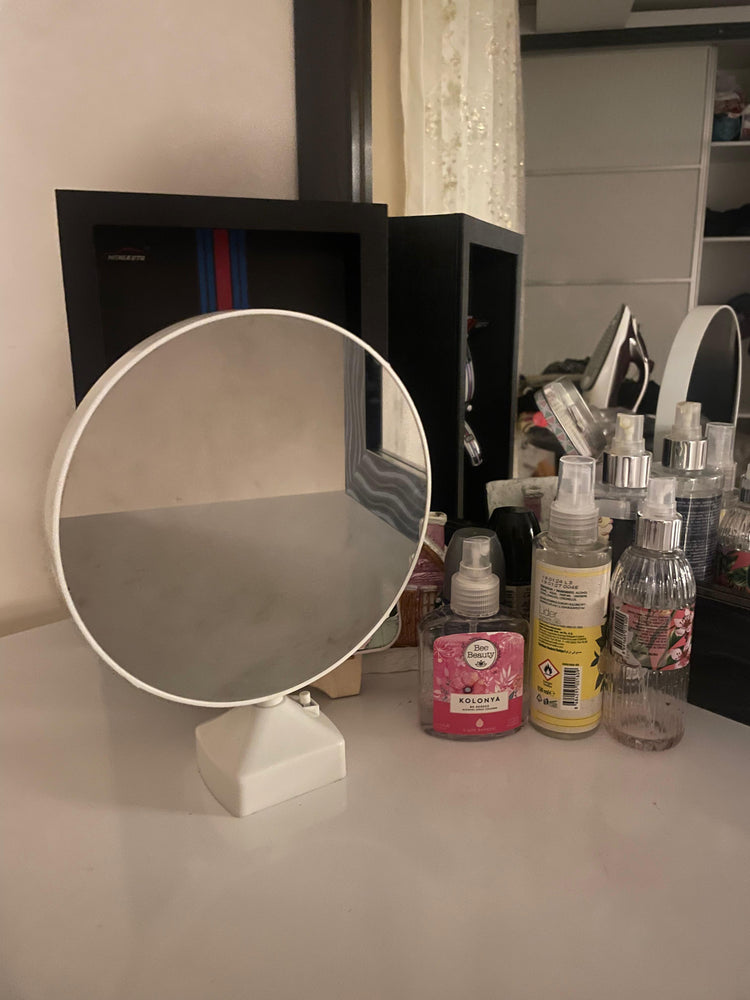 Elevate your beauty routine while brightening your cherished memories. A single touch brings both your reflection and your favorite photos to life